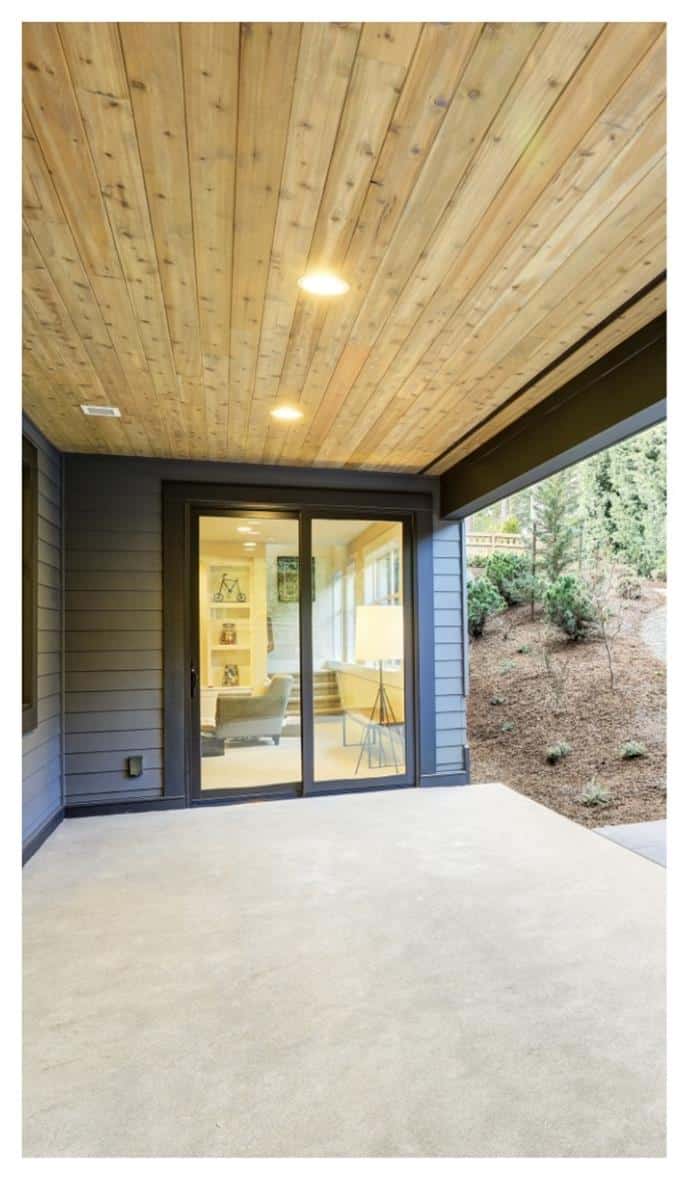 patio with wood slat roof and sliding door into living space