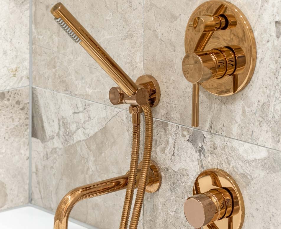 Gold fixtures in a bathroom remodel