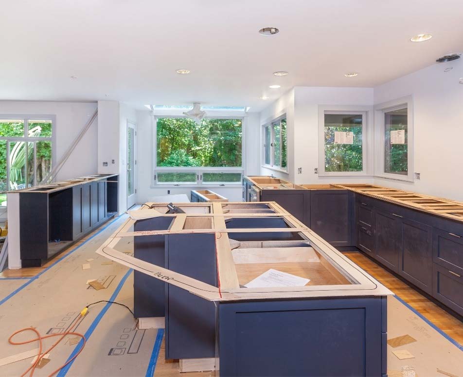 A blue cabinet kitchen under construction