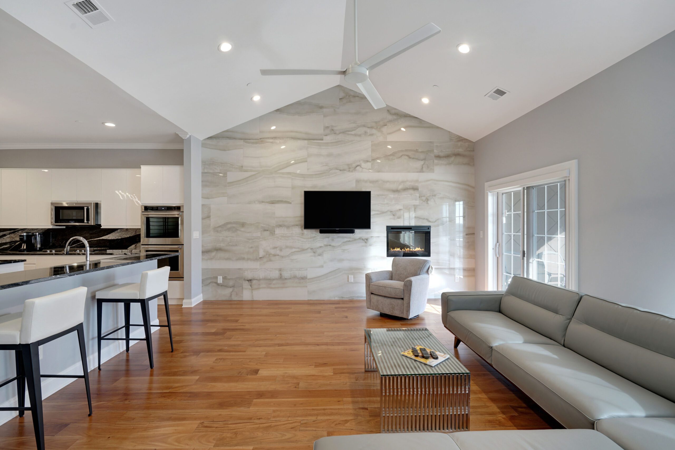 Living Room Home addition with smooth stone accent wall
