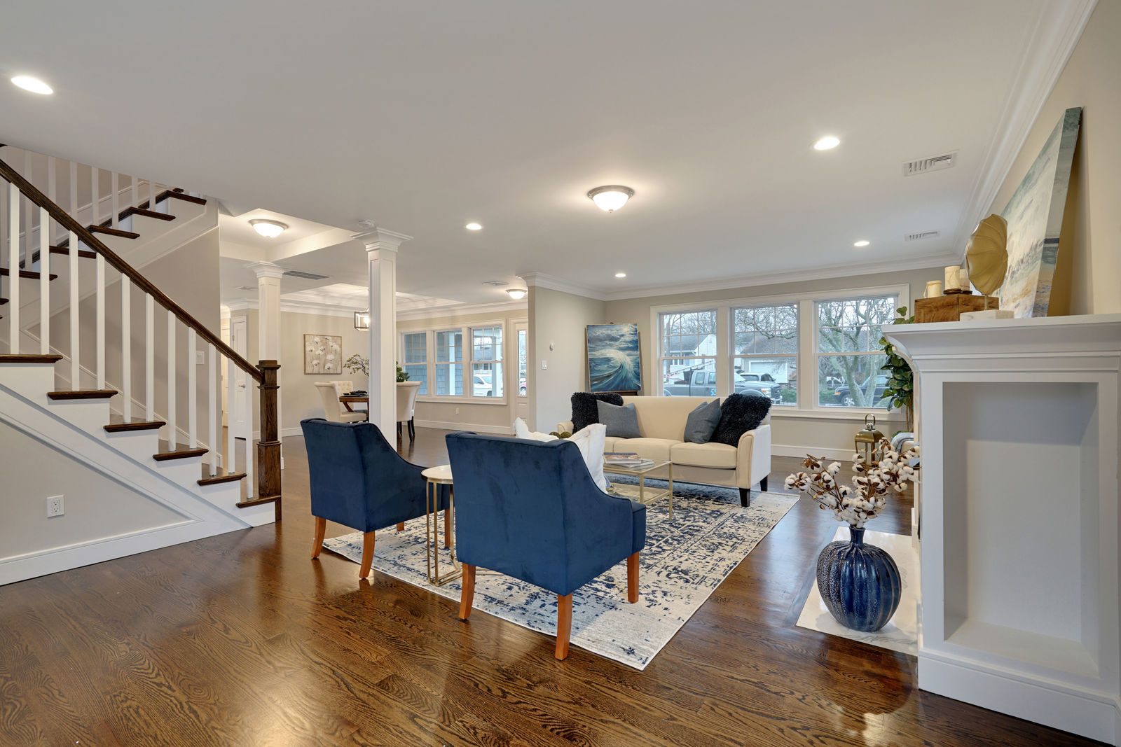Whole-home remodel on Sunset Ave, Point Pleasant NJ — open living room and staircase by C Mac Contracting